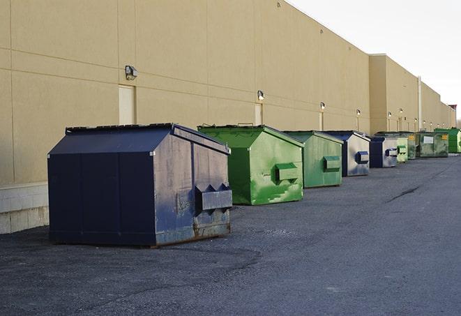 a row of industrial dumpsters at a construction site in Cheektowaga